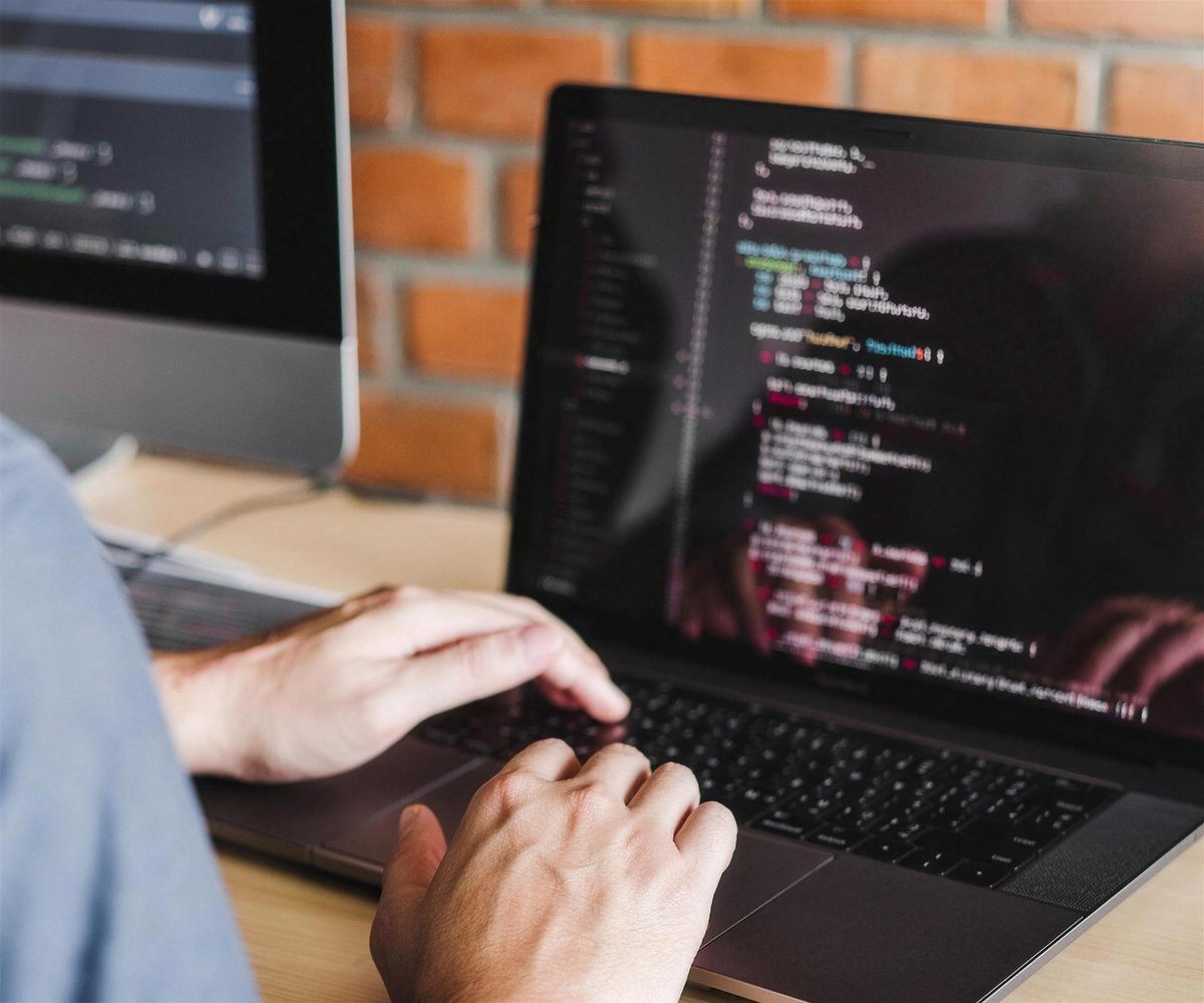 Developer coding on a laptop